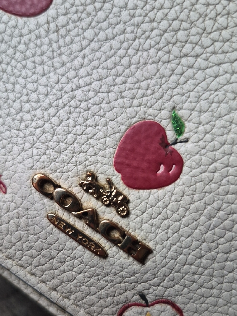 Coach Anna Foldover Clutch Crossbody Bag in a white color with a red apple print - Picture 15 of 16